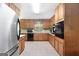 Kitchen with ample wooden cabinet space and stainless steel refrigerator at 25 Hickory Dr, Stockbridge, GA 30281