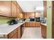 Bright kitchen with white countertops and wooden cabinets and modern appliances at 25 Hickory Dr, Stockbridge, GA 30281