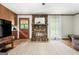 Living room with a stone fireplace, hardwood floors and access to the front porch at 25 Hickory Dr, Stockbridge, GA 30281