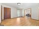 Well-lit living room with hardwood floors, offering views into the adjacent dining area, ideal for entertaining at 25 Hickory Dr, Stockbridge, GA 30281