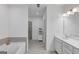 Bright and modern bathroom with a soaking tub, glass shower, and double vanity with clean lines at 1393 Halpern Nw Ln, Kennesaw, GA 30144