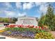 Cedar Township community sign surrounded by colorful tulip flower beds with a well-maintained landscape at 1393 Halpern Nw Ln, Kennesaw, GA 30144