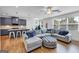 Open-concept living space featuring a modern kitchen island, a cozy seating area, and lots of natural light at 1393 Halpern Nw Ln, Kennesaw, GA 30144