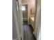 Bathroom with tub/shower combo, wood look floors, floral wallpaper, and vanity at 3244 Abbeywood Dr, Decatur, GA 30034