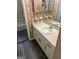 Bathroom featuring single sink vanity with countertop, sink and floral wallpaper at 3244 Abbeywood Dr, Decatur, GA 30034