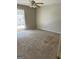 Bedroom showcasing neutral walls, plush carpet and bright window creating a welcoming atmosphere at 3244 Abbeywood Dr, Decatur, GA 30034