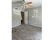 Bedroom featuring neutral walls, carpet, ceiling fan and an open door to an additional room at 3244 Abbeywood Dr, Decatur, GA 30034