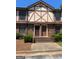 Charming two-story townhome with brick facade, front steps, and well-maintained landscaping at 3244 Abbeywood Dr, Decatur, GA 30034