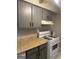 Functional kitchen with white gas range, neutral cabinets, and laminate counters at 3244 Abbeywood Dr, Decatur, GA 30034