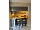 Eat in kitchen featuring a breakfast bar with seating, neutral cabinets and appliances at 3244 Abbeywood Dr, Decatur, GA 30034