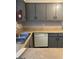 Functional kitchen with stainless steel sink, neutral cabinets, laminate counters, and dishwasher at 3244 Abbeywood Dr, Decatur, GA 30034