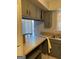 Kitchen eat in bar with tile flooring, cabinets, countertops, and outside view at 3244 Abbeywood Dr, Decatur, GA 30034