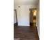 Living room featuring wood floors leading into the kitchen, blending comfort and functionality at 3244 Abbeywood Dr, Decatur, GA 30034