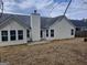The backyard features a gray roof and siding at 114 Revere Turn, Fairburn, GA 30213