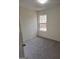 This bedroom has neutral carpeting, natural light, and a cozy feel for relaxation at 114 Revere Turn, Fairburn, GA 30213