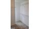 Walk-in closet featuring carpeted floors, and built-in shelving  at 114 Revere Turn, Fairburn, GA 30213
