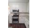 A modern kitchen featuring white cabinets, stainless steel appliances, and granite countertops at 114 Revere Turn, Fairburn, GA 30213