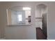 Modern kitchen featuring granite countertops, stainless steel appliances, white cabinets, and modern lighting at 114 Revere Turn, Fairburn, GA 30213