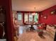Bright dining room with a round table, large window, and decorative light fixture at 525 Brooksdale Dr, Woodstock, GA 30189