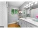 Bright bathroom featuring white cabinets, countertop, and gray accents at 335 Winding Stream Trl, Hampton, GA 30228