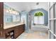 Bright bathroom with a large vanity, soaking tub, and a separate shower at 335 Winding Stream Trl, Hampton, GA 30228