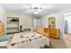 Comfortable bedroom with ceiling fan, a view of a dresser with a mirror, and a view of the entrance at 335 Winding Stream Trl, Hampton, GA 30228