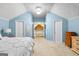 Bedroom with light blue walls and multiple storage closets at 335 Winding Stream Trl, Hampton, GA 30228