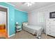 Cozy bedroom with a twin bed, a nightstand and a dresser at 335 Winding Stream Trl, Hampton, GA 30228