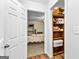 A view into the closet that is filled with storage items and essentials at 335 Winding Stream Trl, Hampton, GA 30228