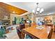 Open floor plan with a view of the living room and kitchen, brightened by chandelier lighting at 335 Winding Stream Trl, Hampton, GA 30228