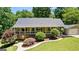 Stunning ranch-style home with a two-car garage, lush landscaping, and a winding walkway at 335 Winding Stream Trl, Hampton, GA 30228