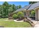 Charming home boasts a landscaped front yard with a walkway leading to a welcoming covered porch at 335 Winding Stream Trl, Hampton, GA 30228