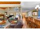 Open-concept design featuring hardwood floors, cathedral ceilings, and combined living spaces at 335 Winding Stream Trl, Hampton, GA 30228