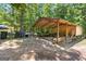 Outside of building featuring a gravel path and forest surrounding the area at 335 Winding Stream Trl, Hampton, GA 30228