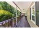 Enjoy the spacious porch overlooking a tranquil wooded area, perfect for relaxing and unwinding at 335 Winding Stream Trl, Hampton, GA 30228