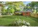 Expansive backyard and mature landscaping with a brick home at 172 W Campbellton St, Fairburn, GA 30213