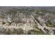 Community aerial view with manicured lawns and mature trees lining the streets, homes, and commercial buildings at 2358 New Salem Trce, Marietta, GA 30064
