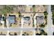 Aerial view of three residences revealing meticulous landscaping, manicured lawns, and inviting swimming pools at 2358 New Salem Trce, Marietta, GA 30064