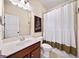 Traditional bathroom features a vanity with modern fixtures and tiled shower at 2358 New Salem Trce, Marietta, GA 30064
