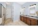Elegant bathroom with double vanity, granite countertops, and a tiled glass shower at 2358 New Salem Trce, Marietta, GA 30064