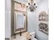 Elegant powder room featuring a decorative mirror and ornate chandelier at 2358 New Salem Trce, Marietta, GA 30064