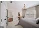 This bedroom provides a tranquil space with a chandelier and natural light at 2358 New Salem Trce, Marietta, GA 30064