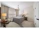 This bedroom offers a chandelier, neutral colors, and a relaxing atmosphere at 2358 New Salem Trce, Marietta, GA 30064