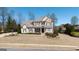 Charming brick and stone two-story home with a well-manicured lawn and inviting front porch at 2358 New Salem Trce, Marietta, GA 30064