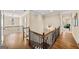 Open hallway with hardwood floors and iron railings at 2358 New Salem Trce, Marietta, GA 30064