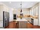 Well-appointed kitchen featuring stainless steel appliances, custom cabinets, and a stylish center island at 2358 New Salem Trce, Marietta, GA 30064