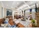 Spacious living room with coffered ceilings, stone fireplace, hardwood floors, and open-concept design at 2358 New Salem Trce, Marietta, GA 30064