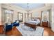Serene main bedroom with hardwood floors, a blue ceiling, and plenty of natural light at 2358 New Salem Trce, Marietta, GA 30064
