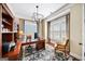 Bright home office with custom built-ins, plantation shutters, and a comfortable workspace at 2358 New Salem Trce, Marietta, GA 30064