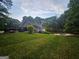 Lush backyard featuring a swimming pool with mature trees and plenty of greenery at 3650 Bay Leaf Dr, Loganville, GA 30052